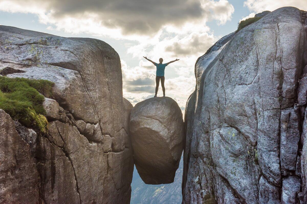 Man on the Kjeragbolten in Norway