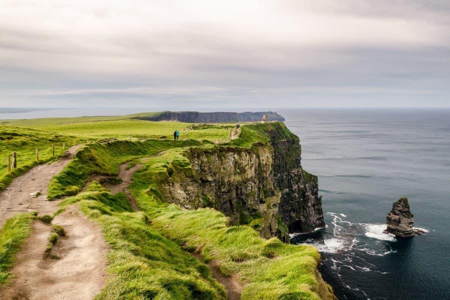 Here are the steep cliffs along the Irish coast. They are covered in lush green vegetation.