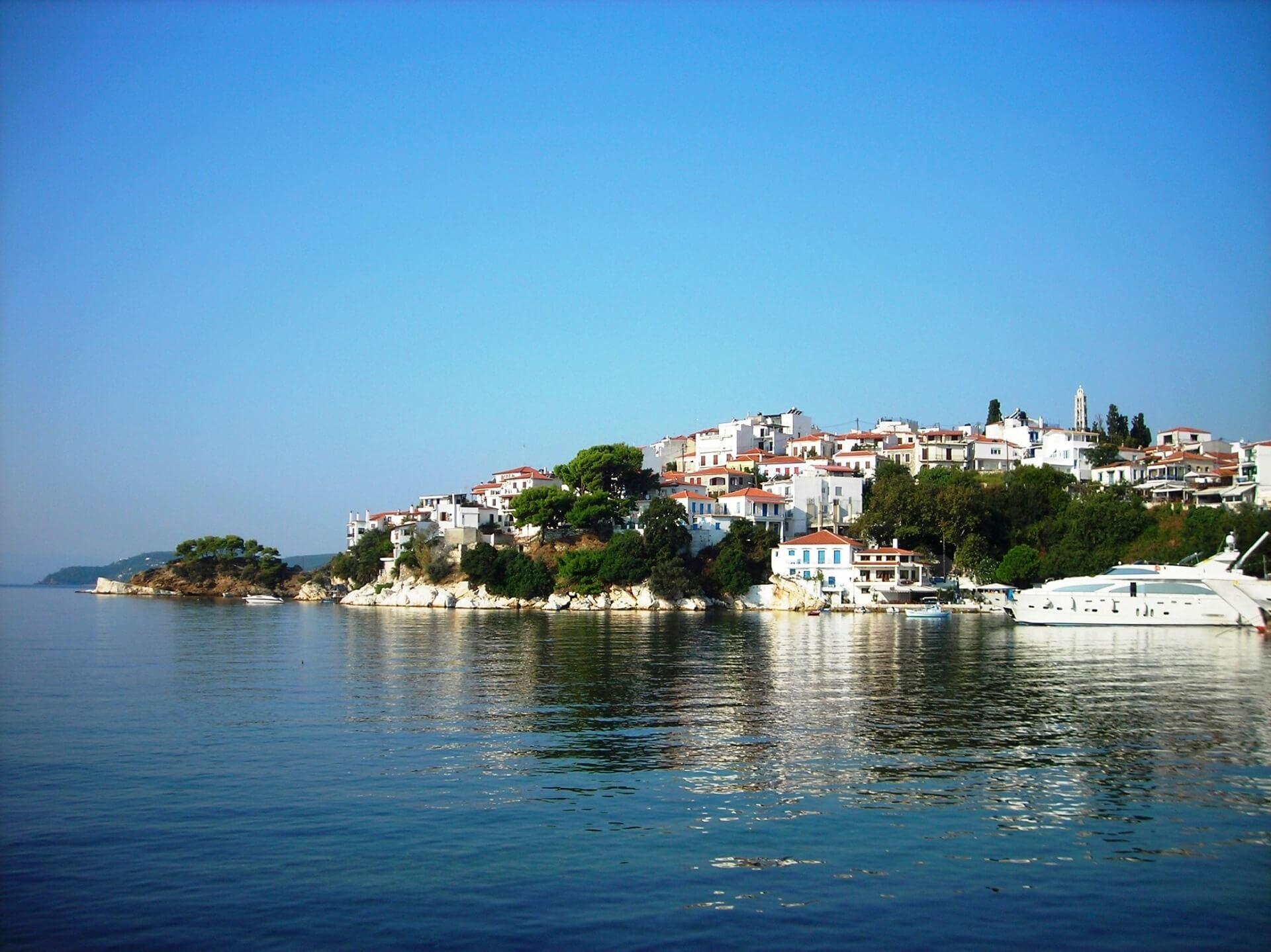 The Bourtzi peninsula divides the harbor of Skiathos