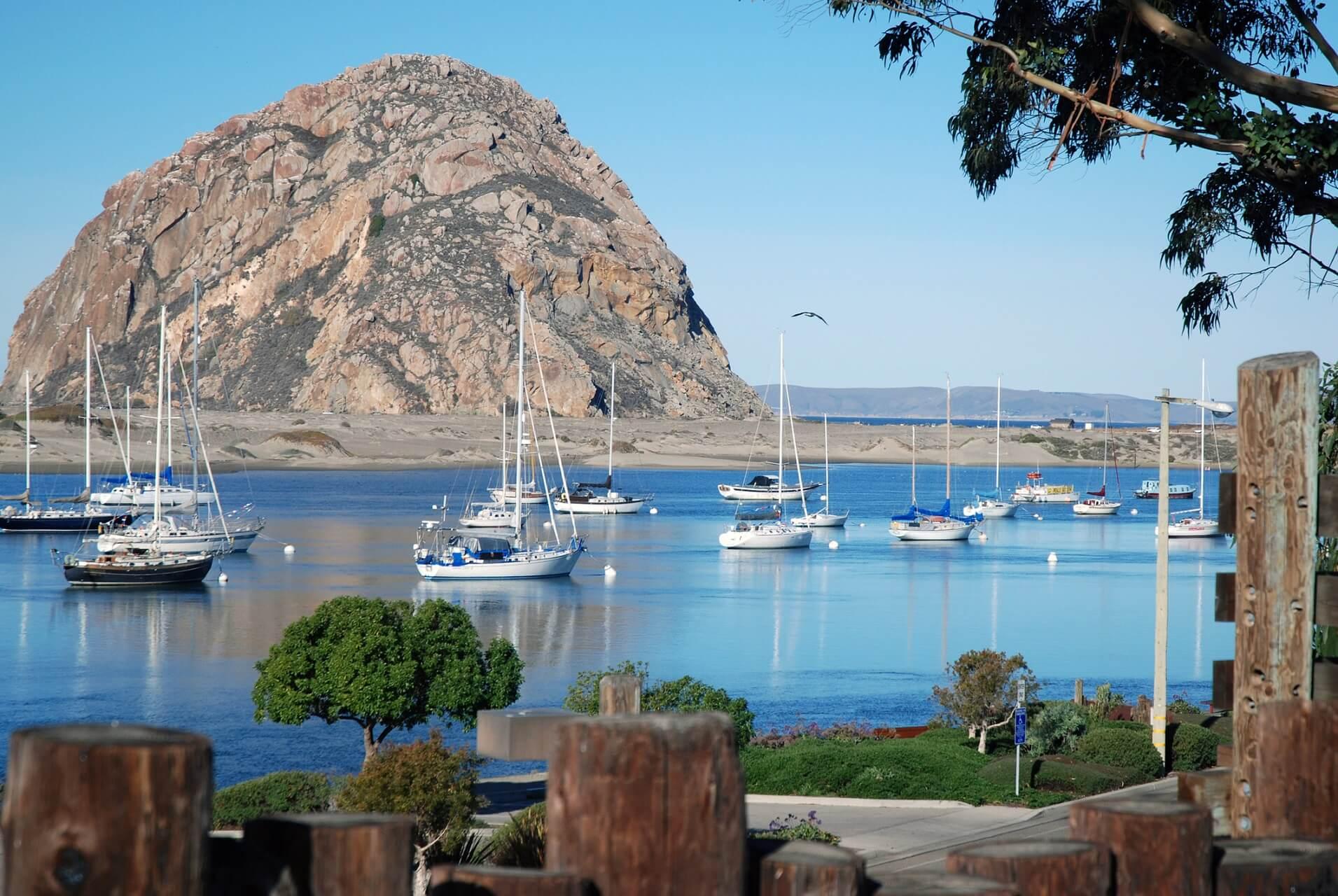Morro Rock sits in the water at Morro Bay