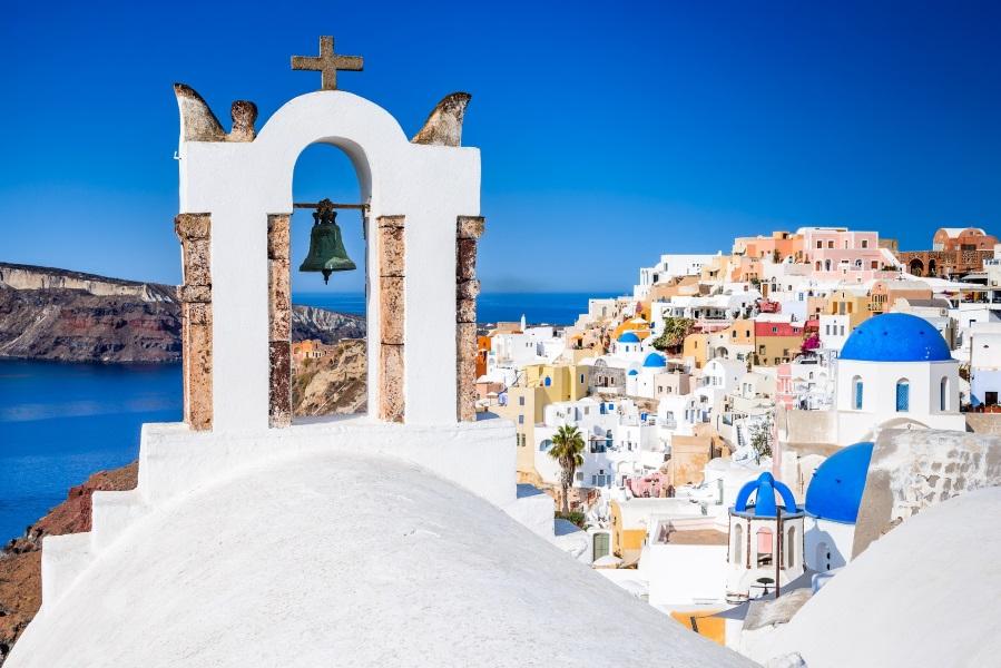 Oia, Santorini, Greece. Famous attraction of the white village with cobbled streets, Greek Cyclades Islands, Aegean Sea