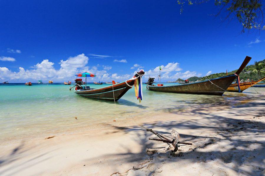 Typical longtail boats on the beach of Koh Tao, Thailand.