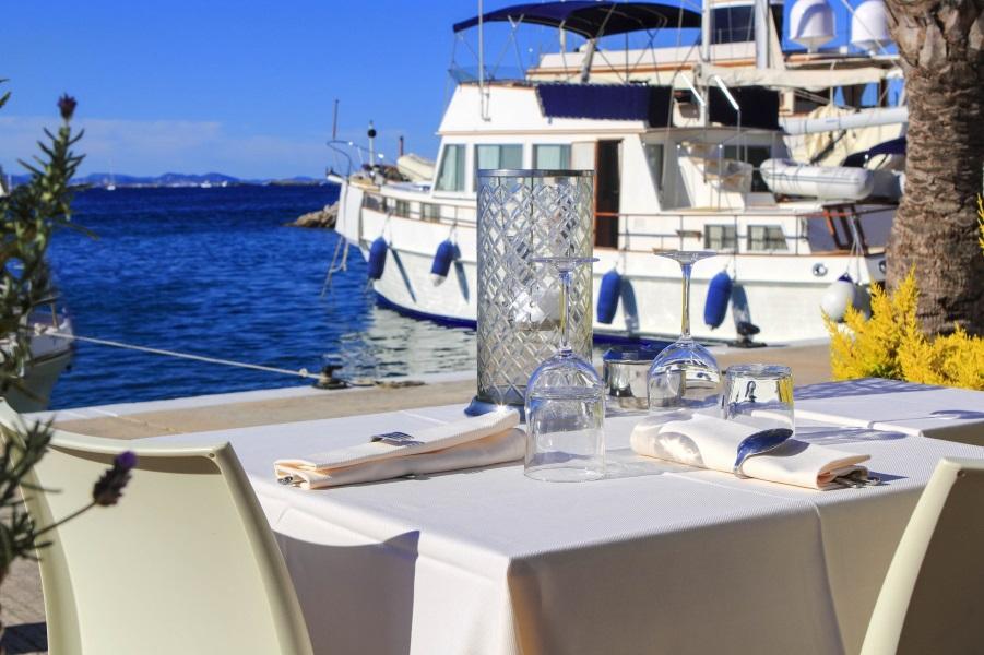 table dish glasses on marina port Mediterranean dinner