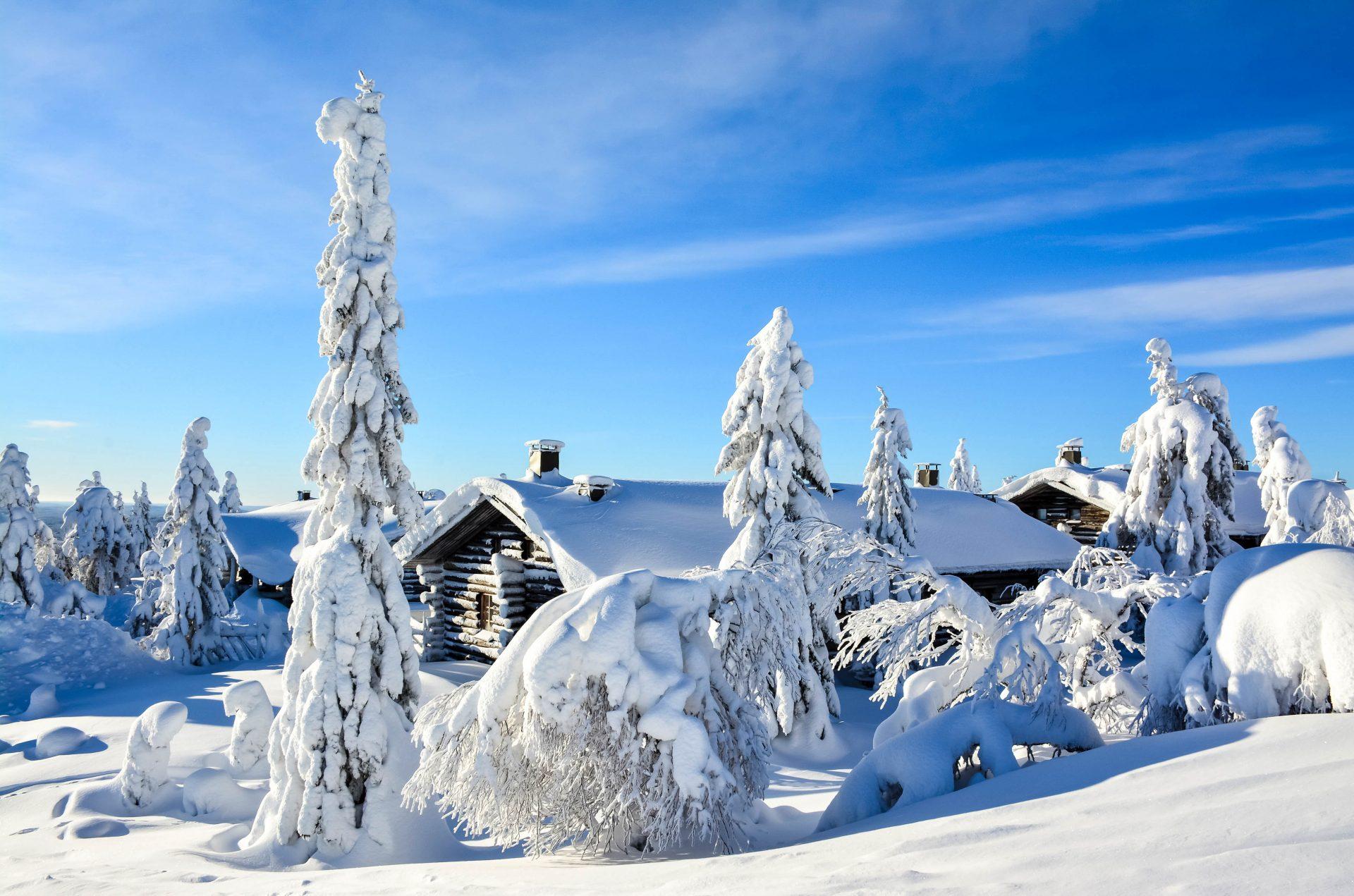 A snow-covered cabin in a winter landscape