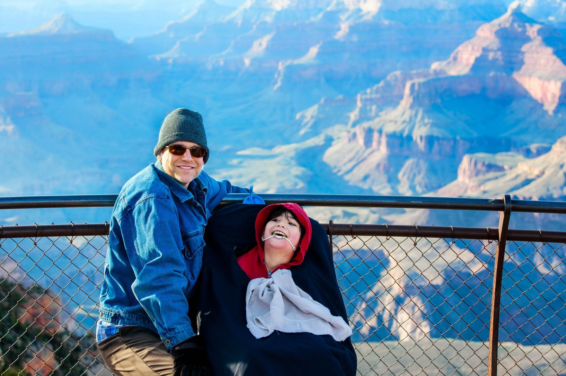 Father and son in a wheelchair at the Grand Canyon