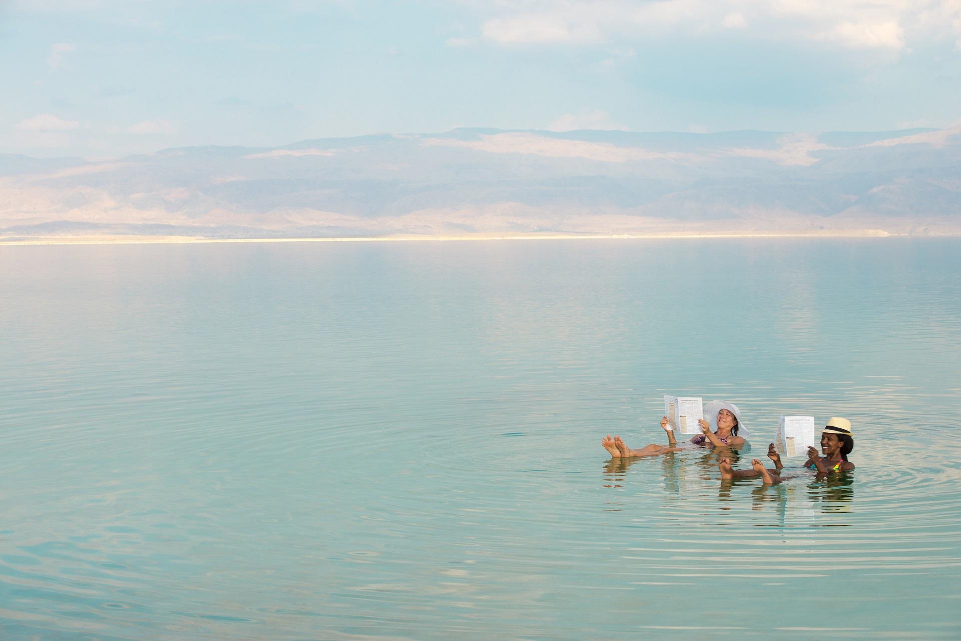 Two women swimming in the Dead Sea.