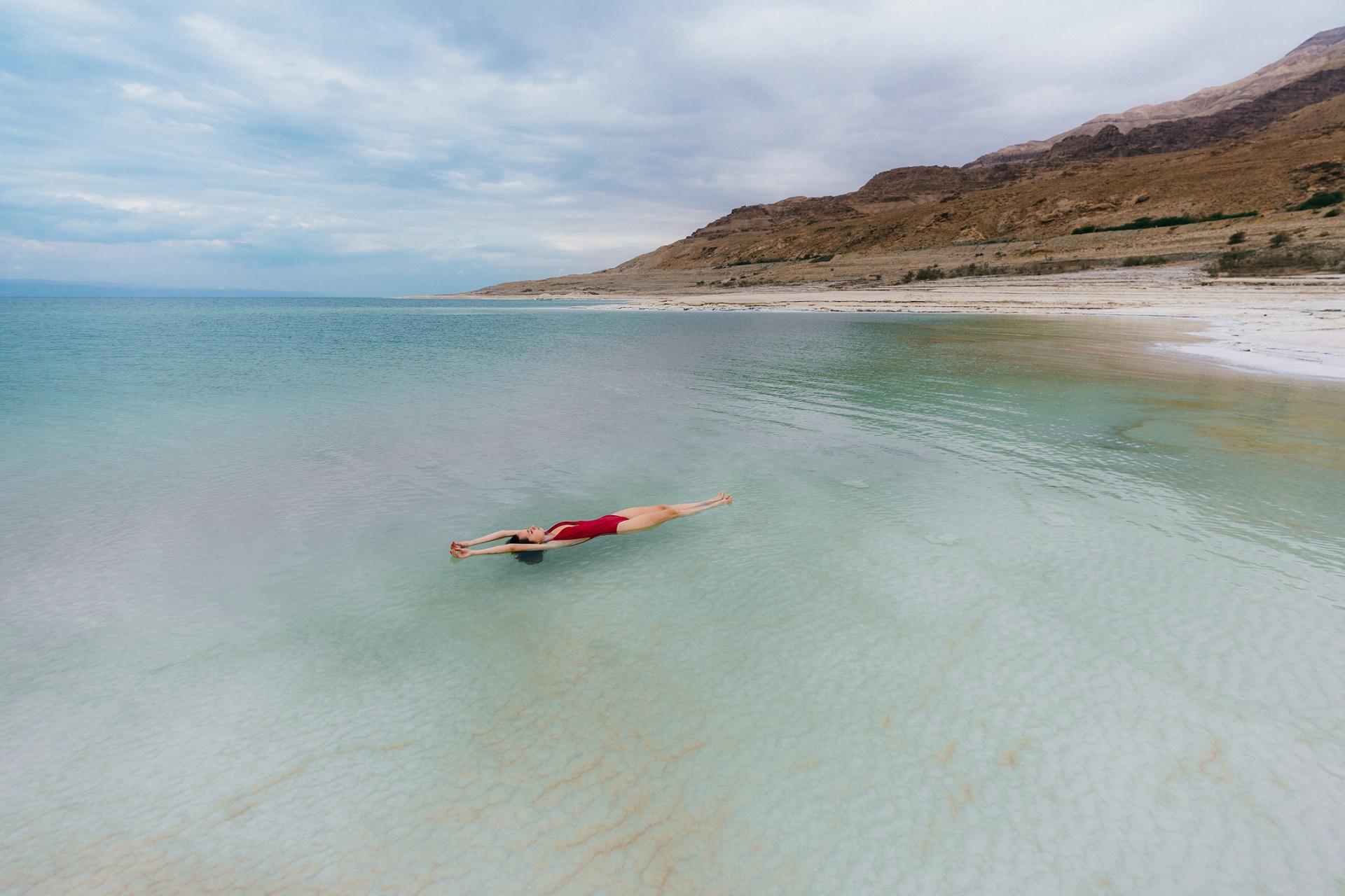 A woman floating in the Dead Sea.