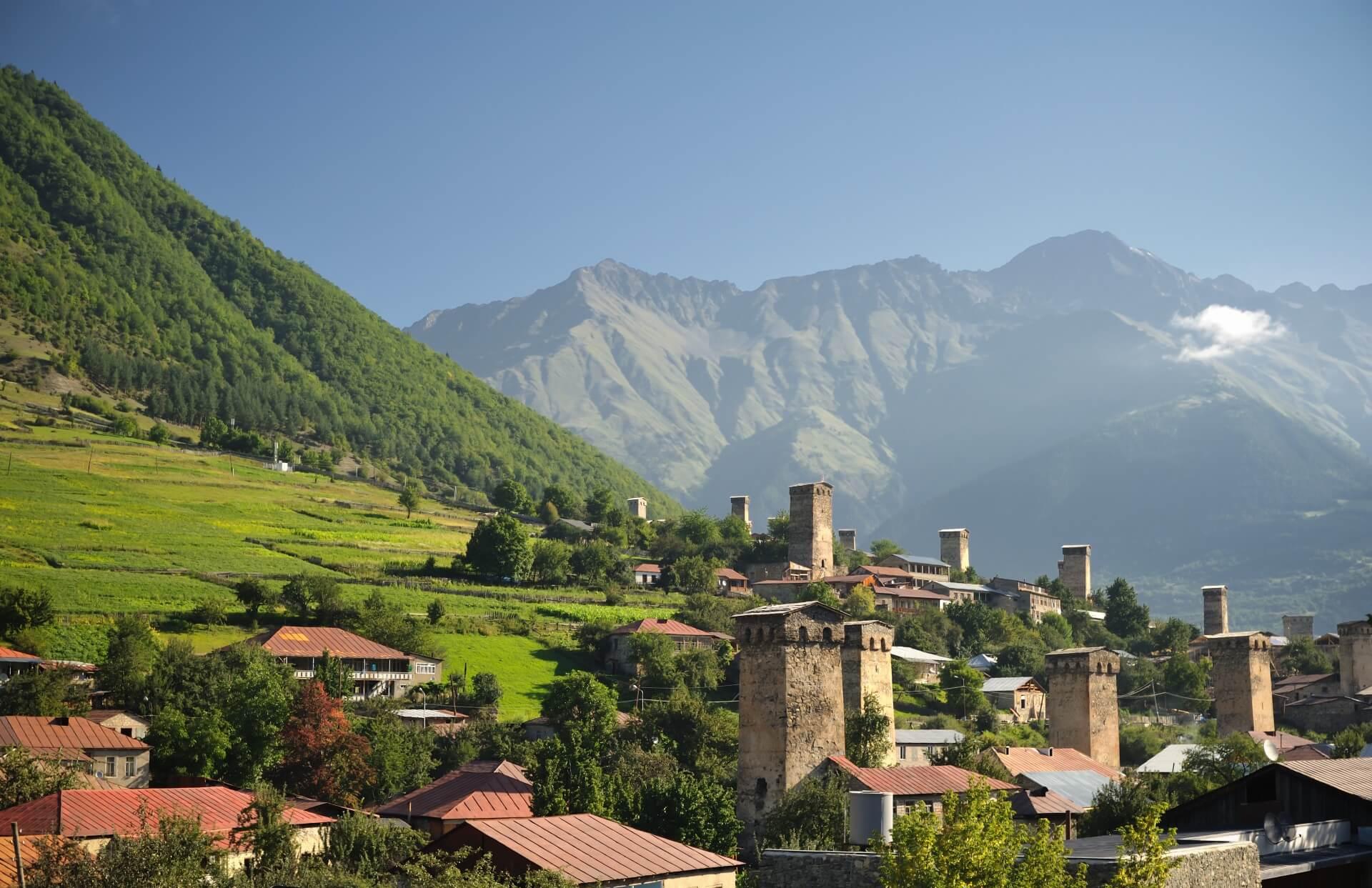 View of Mestia in Georgia. In the background, you can see the Caucasus mountains, while the fortified towers stand out in the foreground.