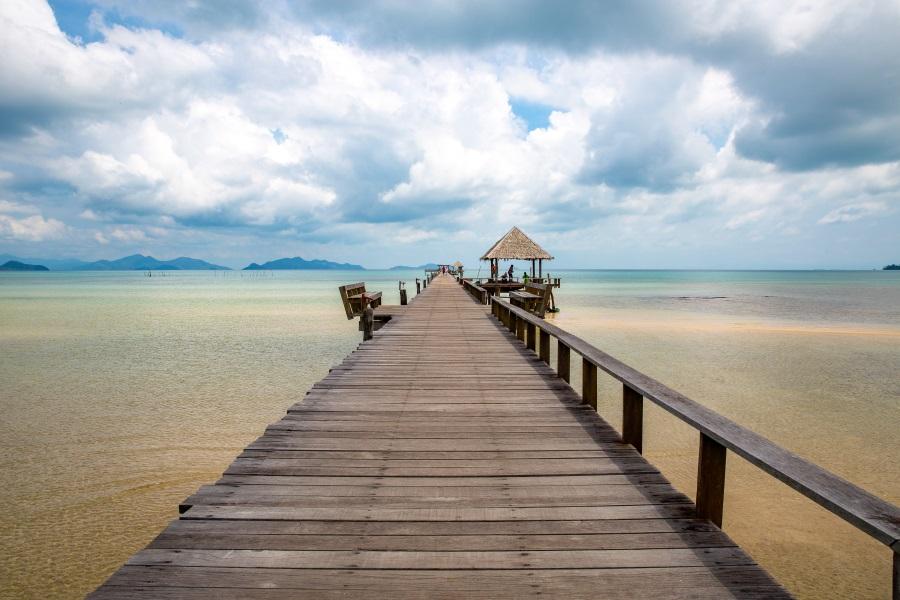 Pier-beach-with-sea-and-cloudy-sky-at-Ao-Tan-beach-Koh-Mak-island-Trat-Thailand_shutterstock_1419511415_900x600