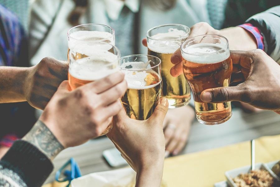 Friends toast with beer