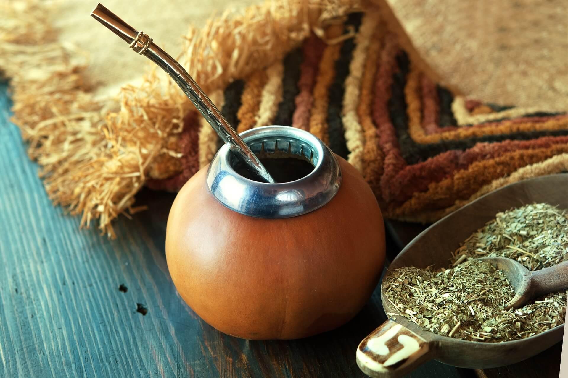 South America mate tea, dried leaves in wooden gourd with calabash
