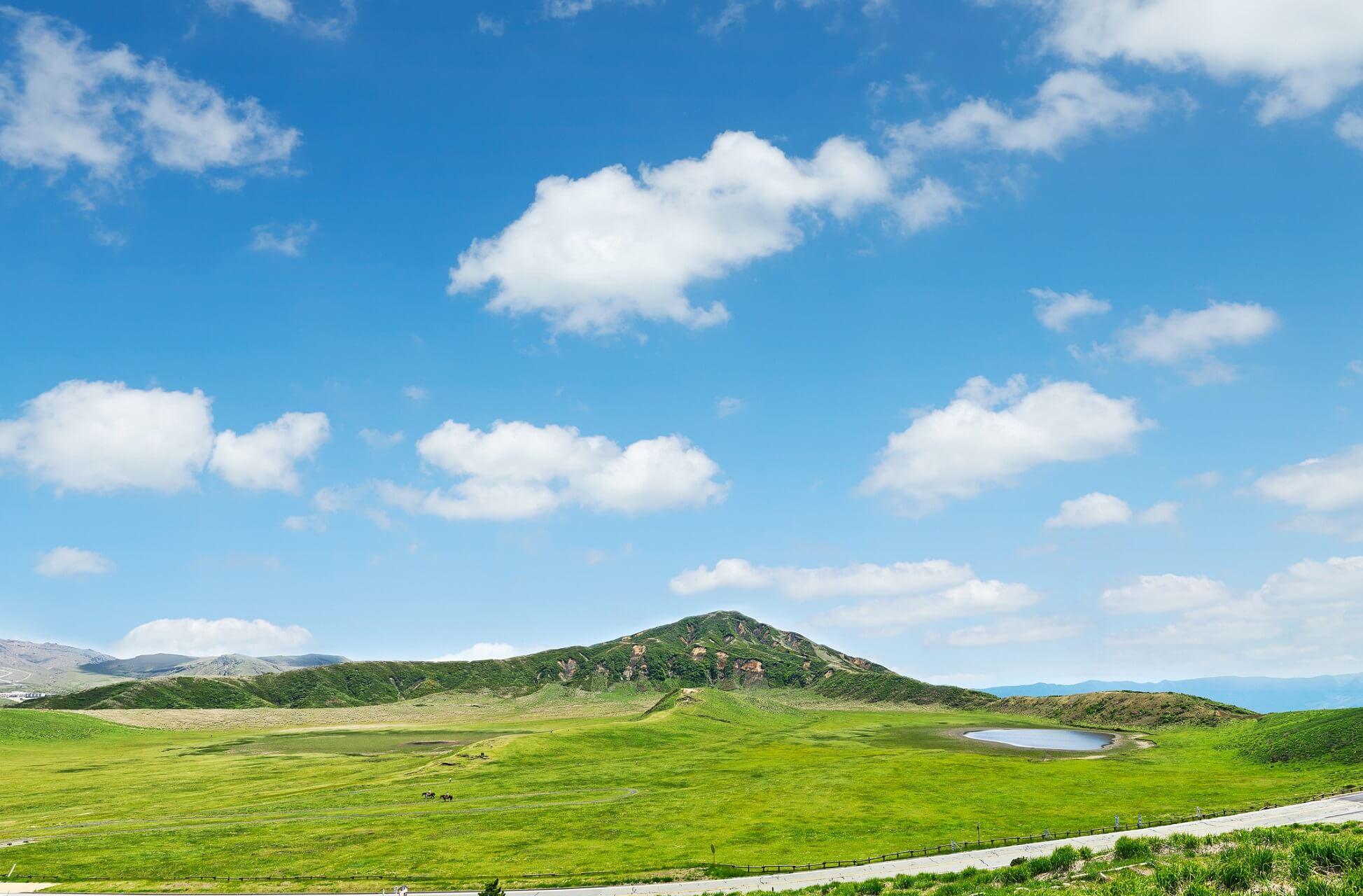 Green meadows in the Kusasenri prairie on Kyushu in Japan.