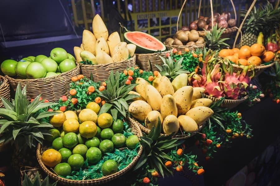Tropical fruits such as mangoes, dragon fruits, and apples in Khao Lak at the night market