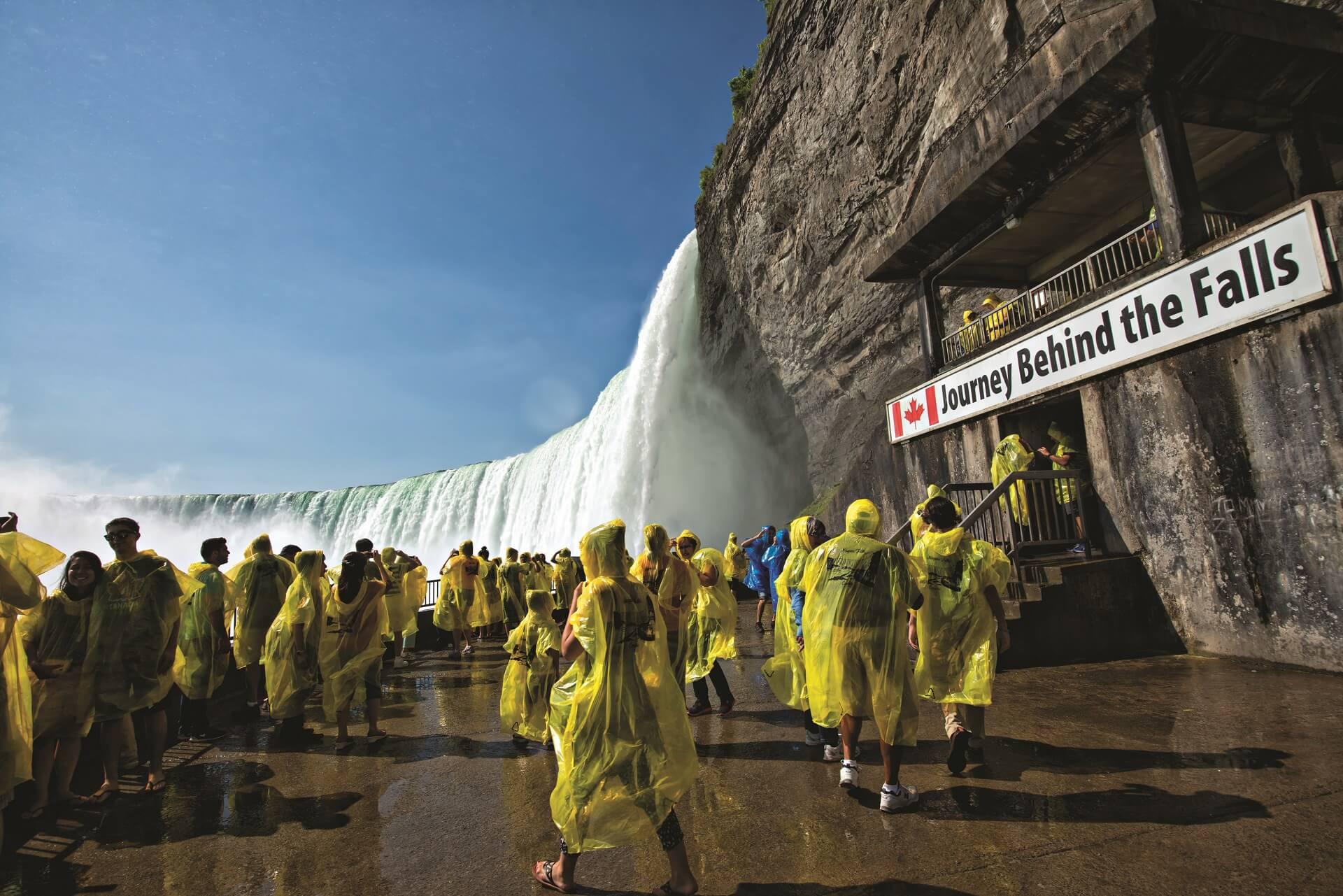 Tourists in raincoats visiting Niagara Falls