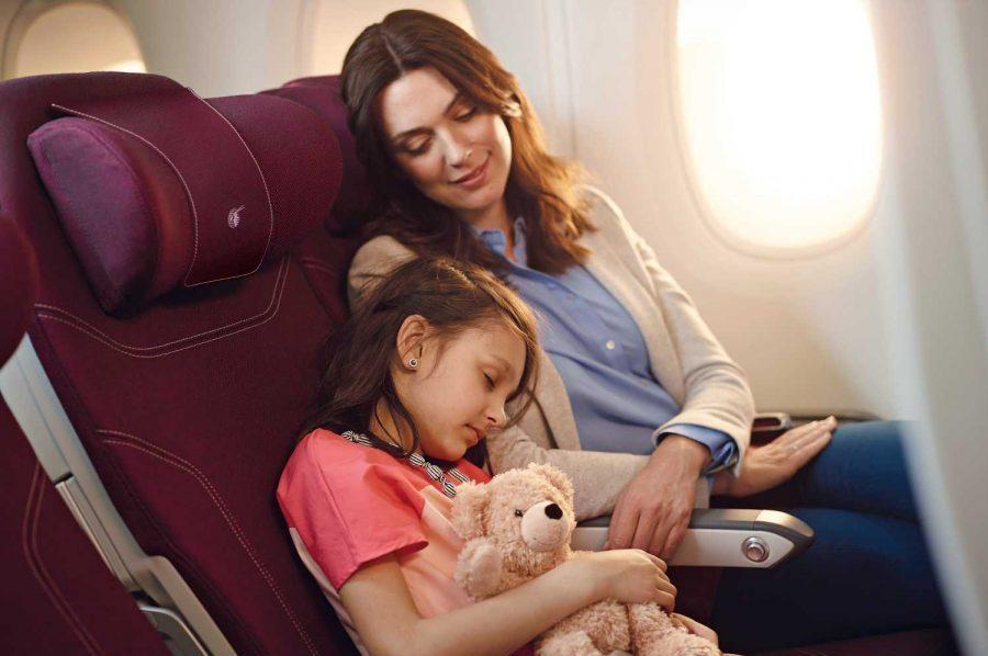 Mother and child in the Economy Class of a Qatar Airways A350