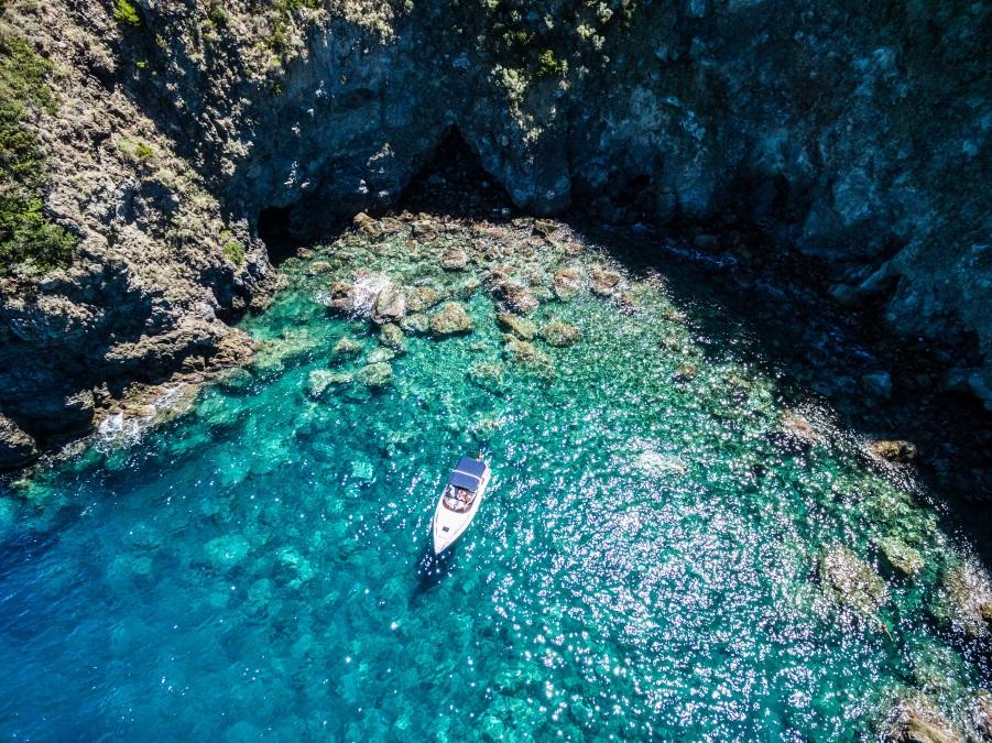 Ischia, lonely boat in a turquoise Naples