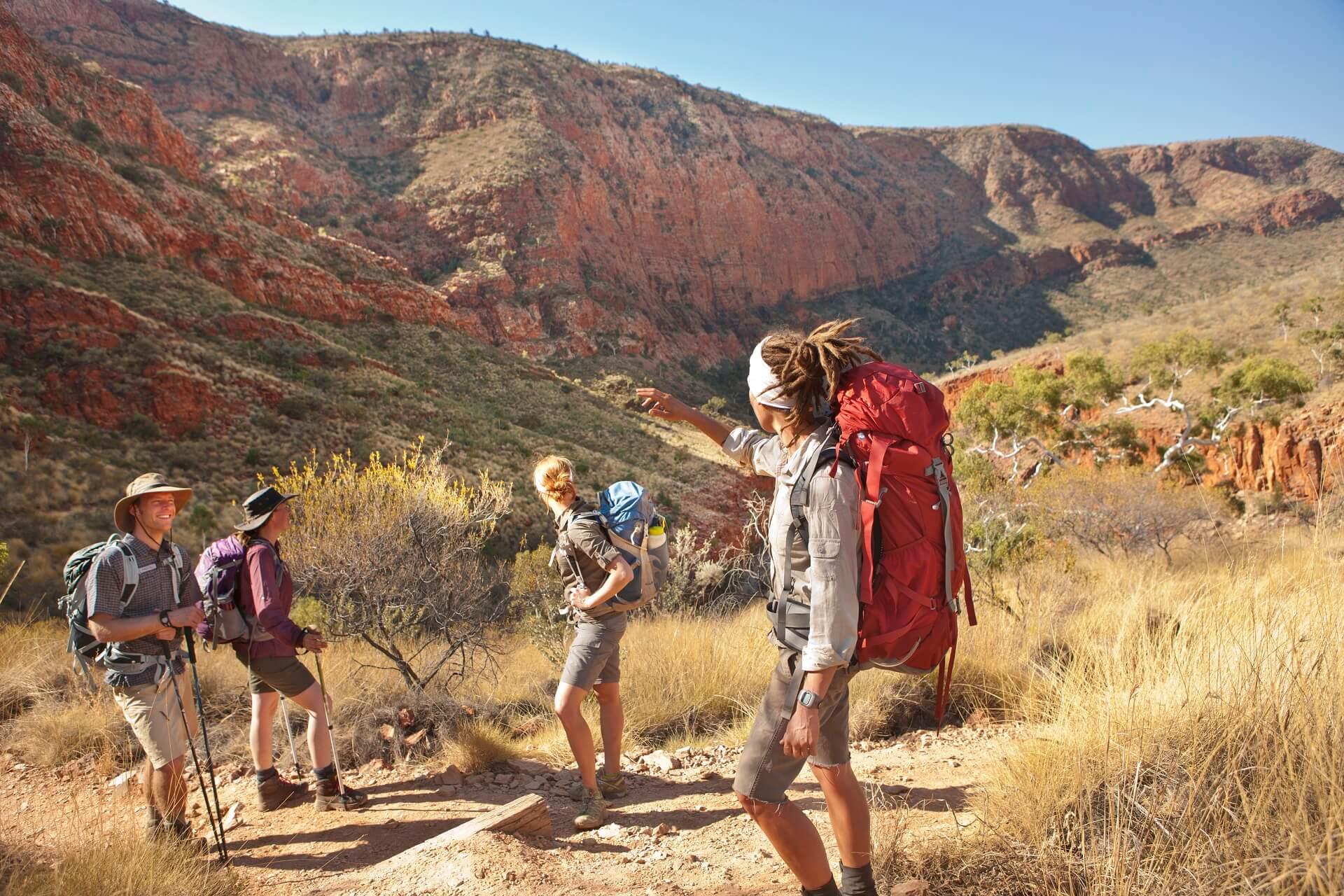 Hiking group on the long-distance hiking trail Larapinta Trail in the West MacDonnell Ranges in the Northern Territory of Australia.