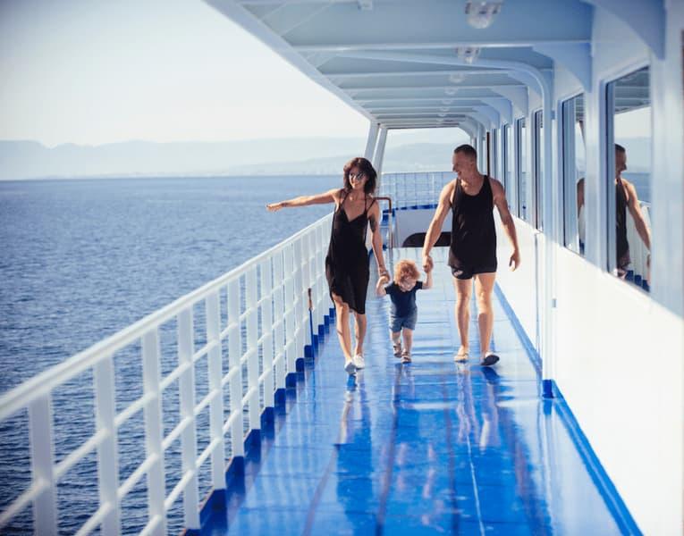 A mother and father with their toddler on a cruise ship.