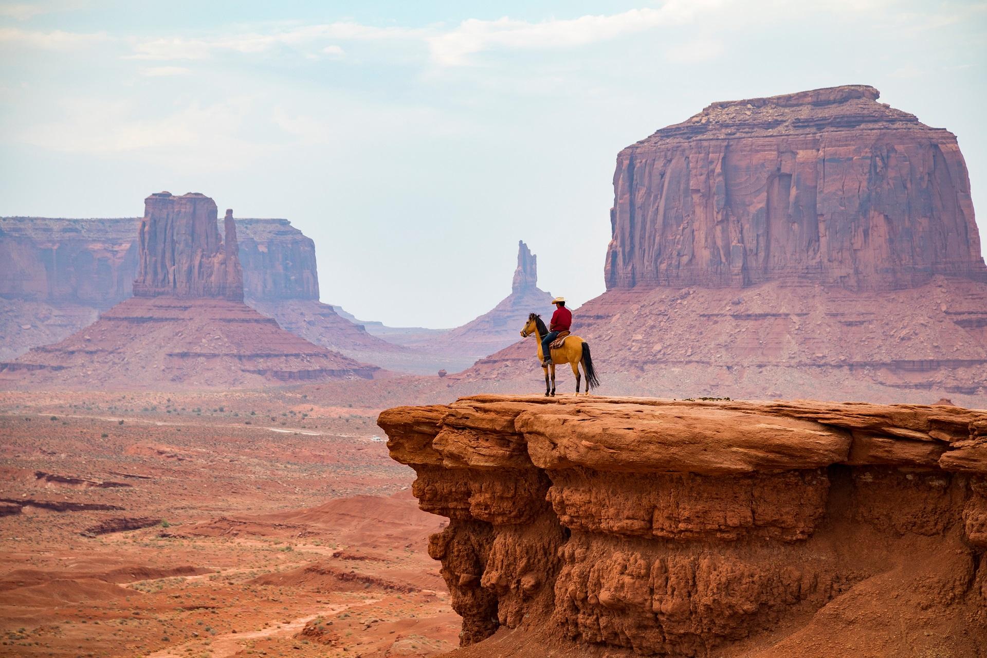Cowboy on a horse in Monument Valley