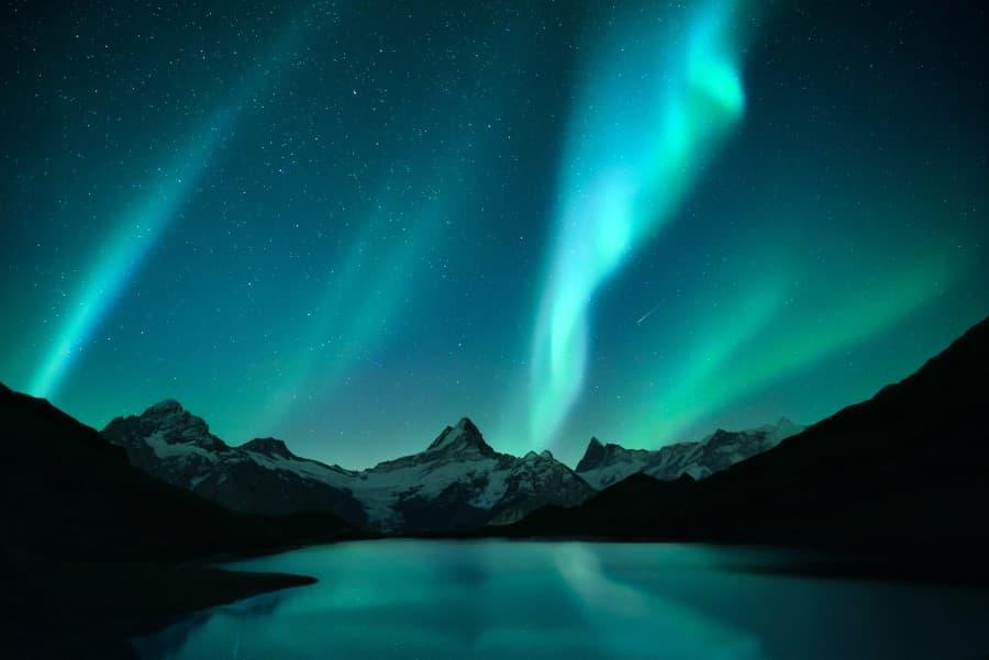 Aurora Borealis Northern Lights over a winter mountain range
