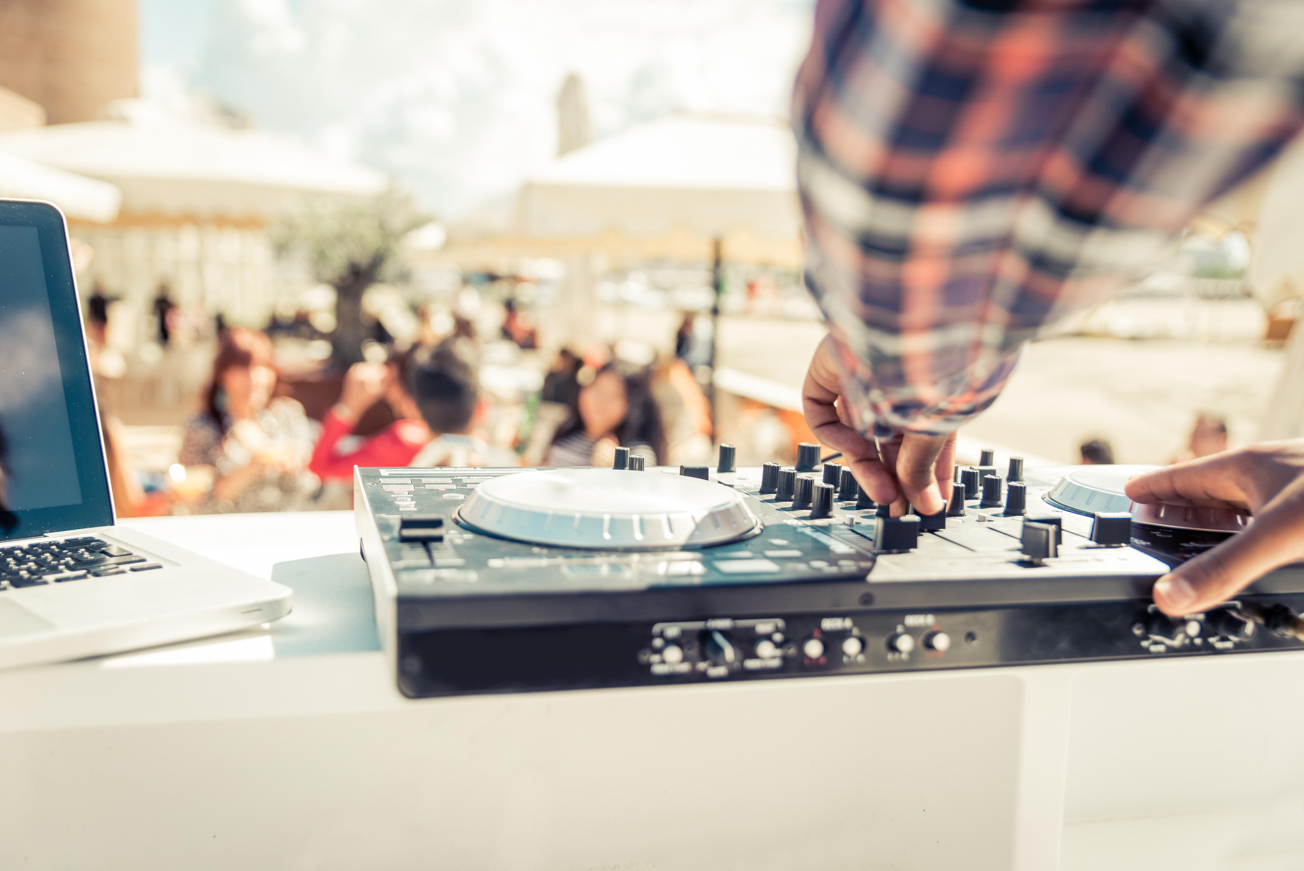 A DJ energizes the dancing crowd at the Beer King