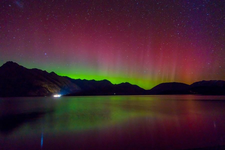 The beautiful Aurora Australis and Milky Way over Lake Wakatipu, Kinloch, New Zealand, South Island.