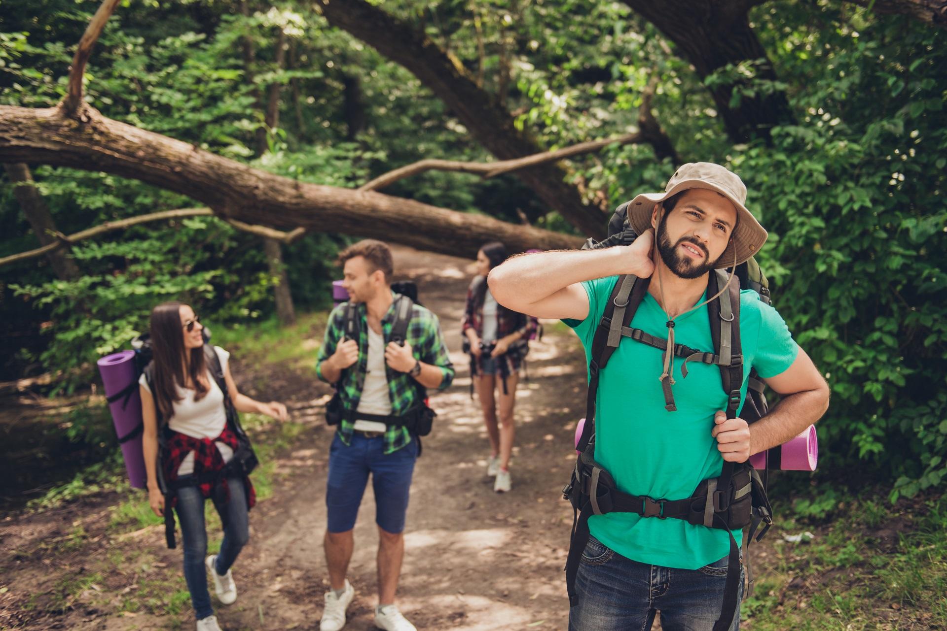 A man feels pain while hiking
