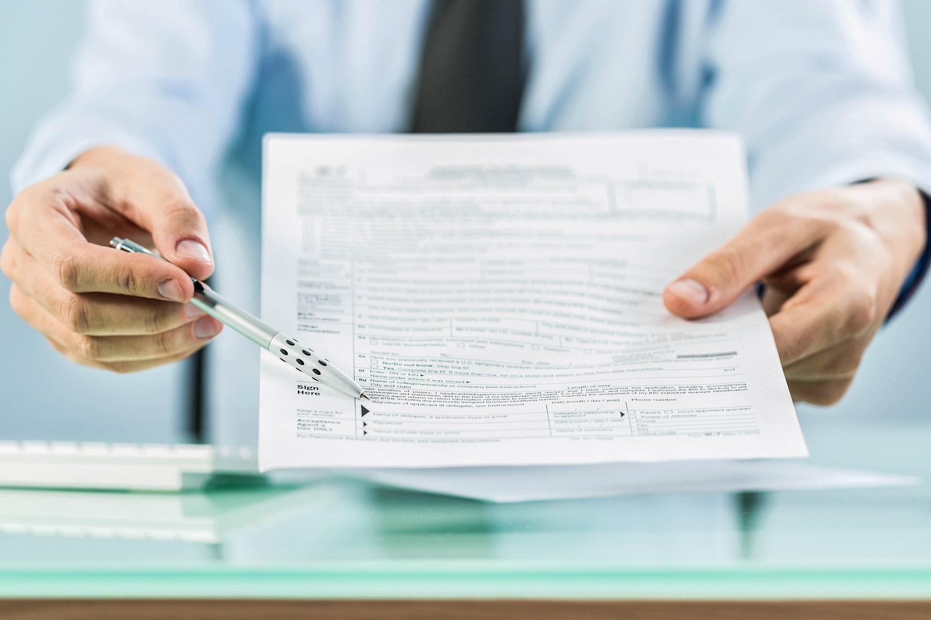 A doctor asks for a signature