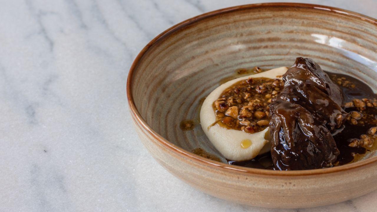 Reminiscent of a Paris bistro, Top Cuvée offers standout dishes like beef and smoked eel tartar, and braised pig's cheek (pictured).