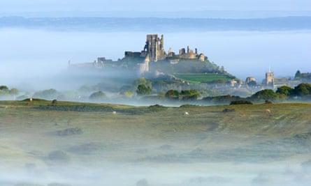 Country Diary : Corfe Castle surrounded by early morning mist on the Isle of Purbeck, Dorset