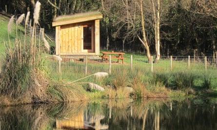 One of dens, at the water's edge at One Cat Farm, Wales.