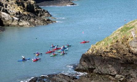 Canoeists off the Pembrokeshire coast close to the eco lodge accommodation of Preseli Venture